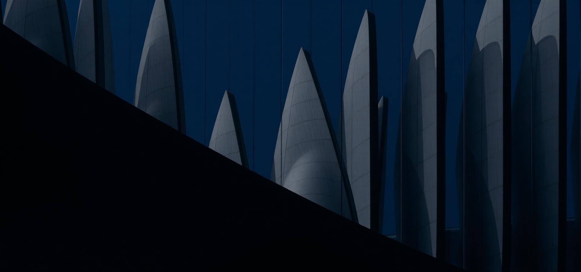 Abstract architectural fins in deep navy